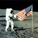 Neil Armstrong on the moon with the US flag